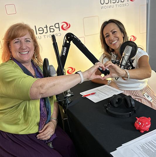 Patelco Employees Michele Enriquez and Cara Houck at the podcast desk.