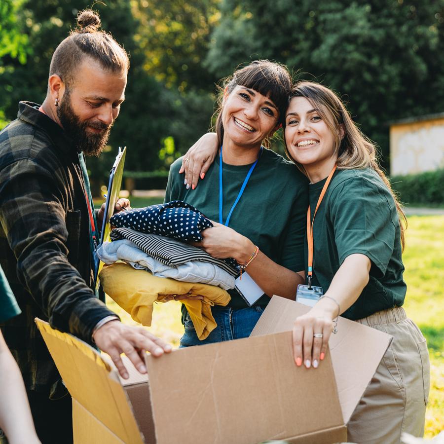 People in the community helping pack donated goods